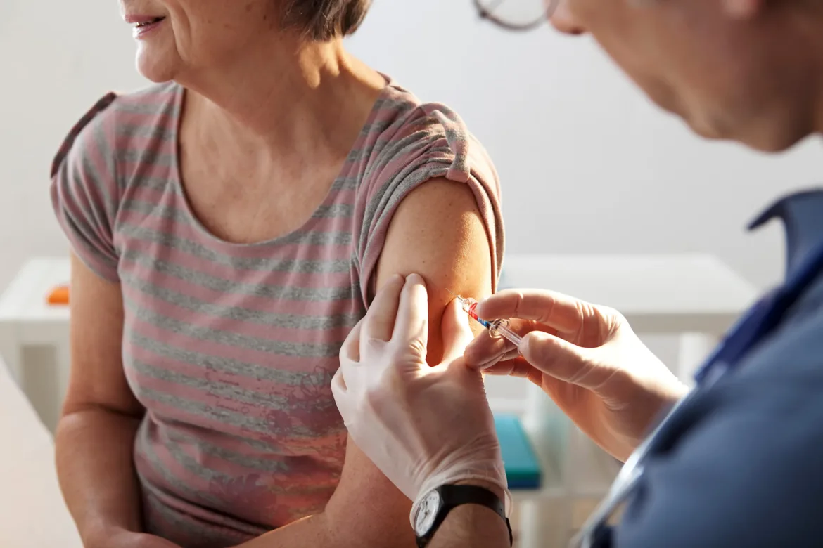 woman receiving the flu vaccine