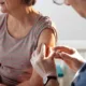 woman receiving the flu vaccine