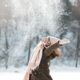 woman playing in the snow