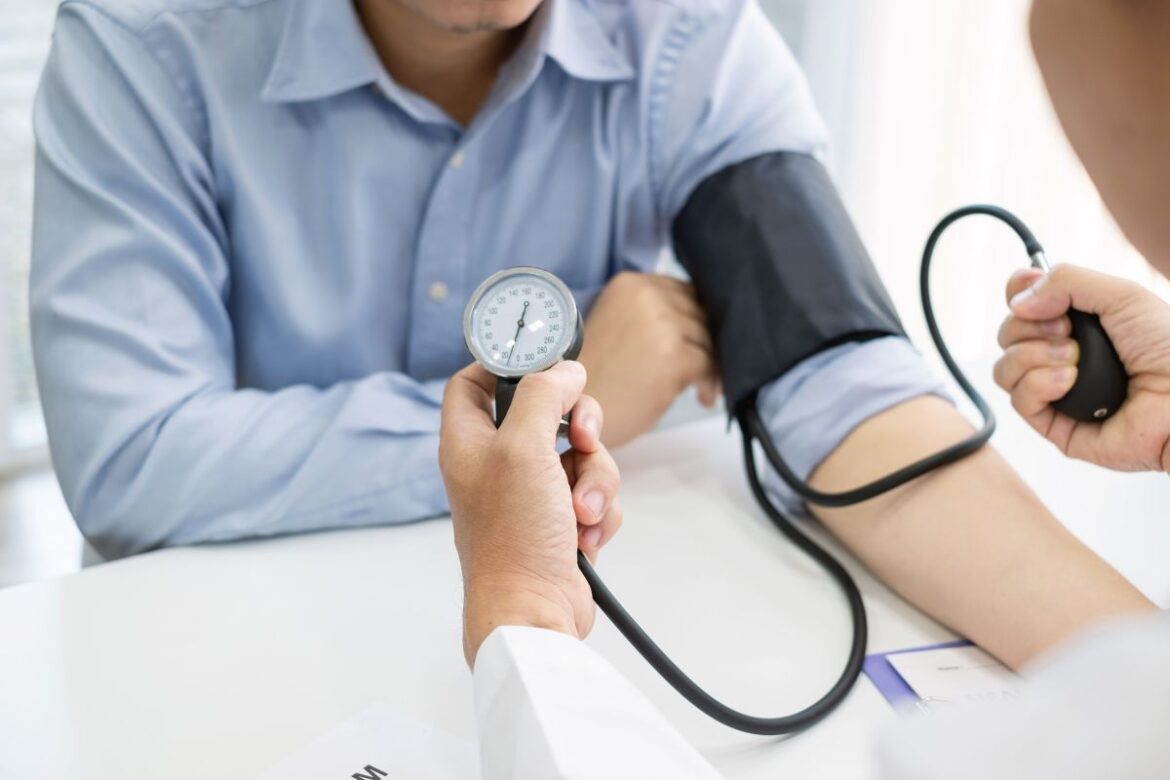 patient receiving blood pressure screening