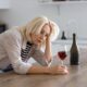 woman drinking wine at home